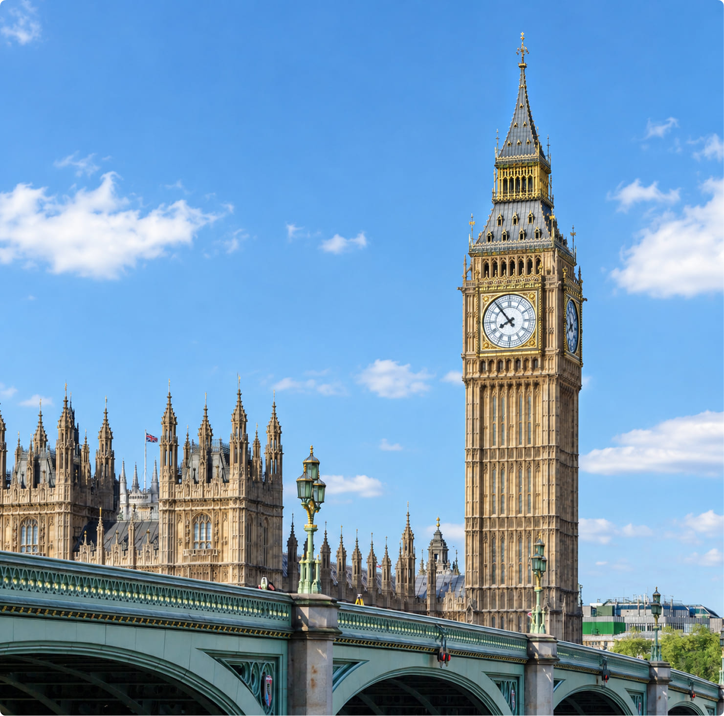 Big Ben and the Houses of Parliament rising above Westminster Bridge in London on a sunny day