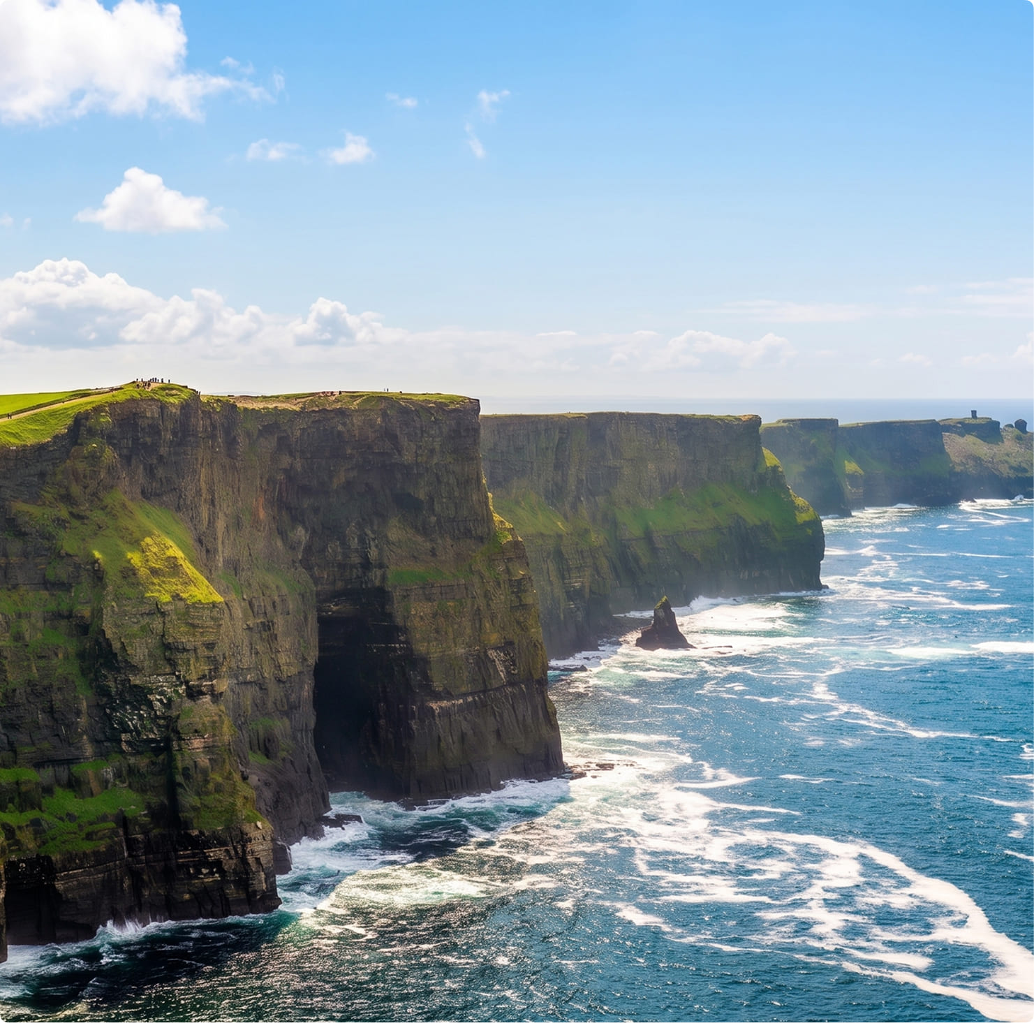 Dramatic Cliffs of Moher rising above the Atlantic Ocean on Ireland's west coast on a sunny day