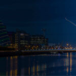 Samuel Beckett Bridge and the Convention Centre Dublin lit up along the River Liffey at dusk