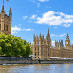The Houses of Parliament along the River Thames, with Victoria Tower on the left and Big Ben in the distance